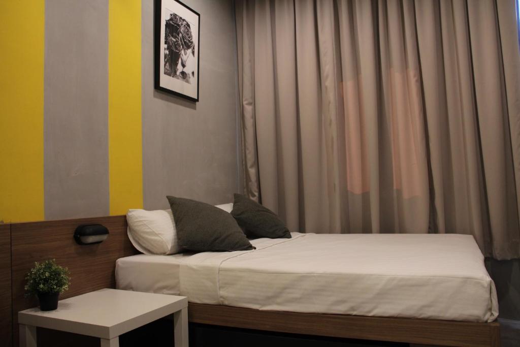 Postel nebo postele na pokoji v ubytování Tido Hostel Penang