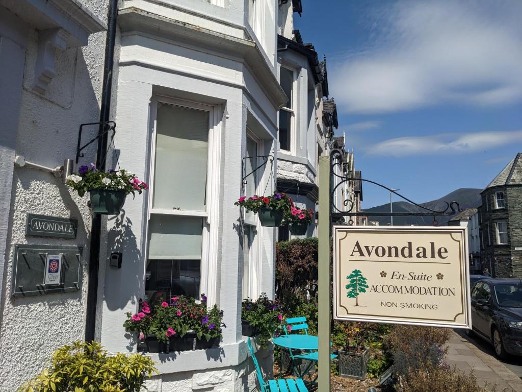 a sign for a restaurant on the side of a building at Avondale Guest House in Keswick