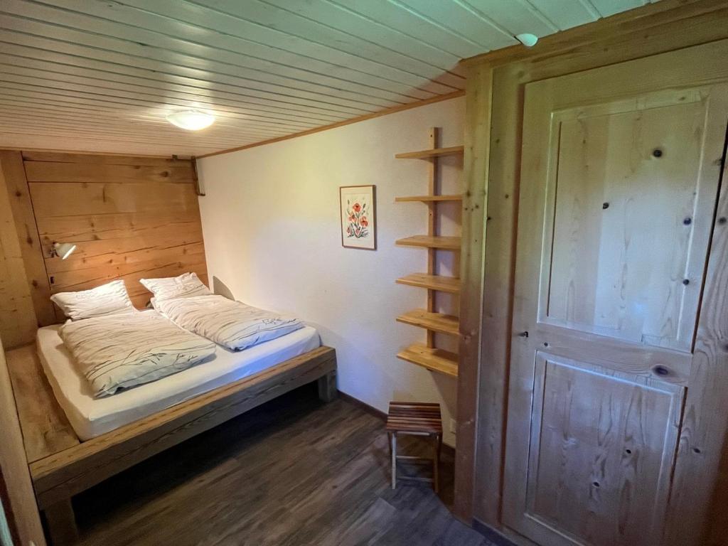 Postel nebo postele na pokoji v ubytování Chalet Sonnenheim mit atemberaubender Aussicht