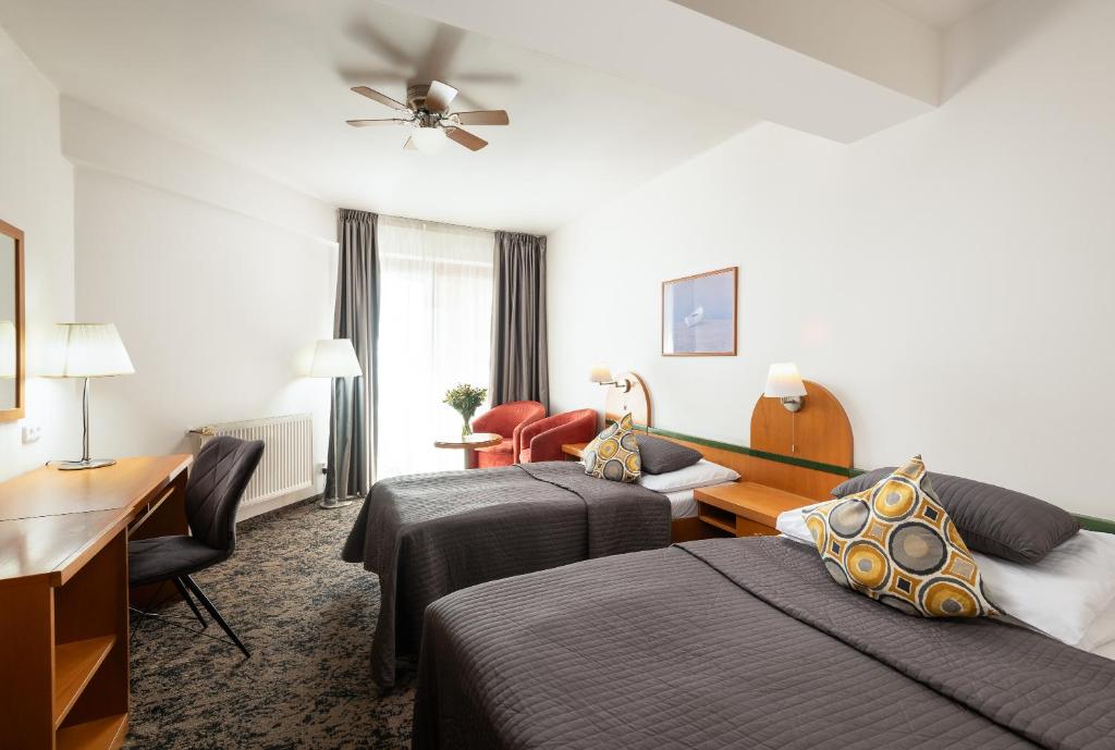 Postel nebo postele na pokoji v ubytování Hotel Troja