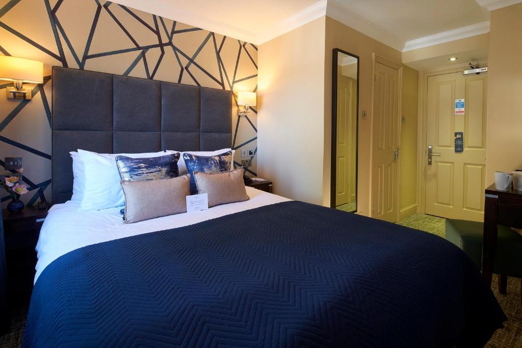 Un ou plusieurs lits dans un hébergement de l'établissement Mandolay Hotel Guildford