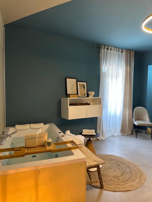 a living room with a bed and a table at VILLA CHIARA in Torre Orsina