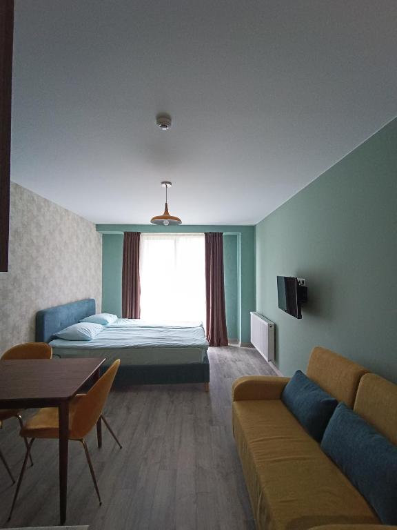 Postel nebo postele na pokoji v ubytování Новый Гудаури Loft 2