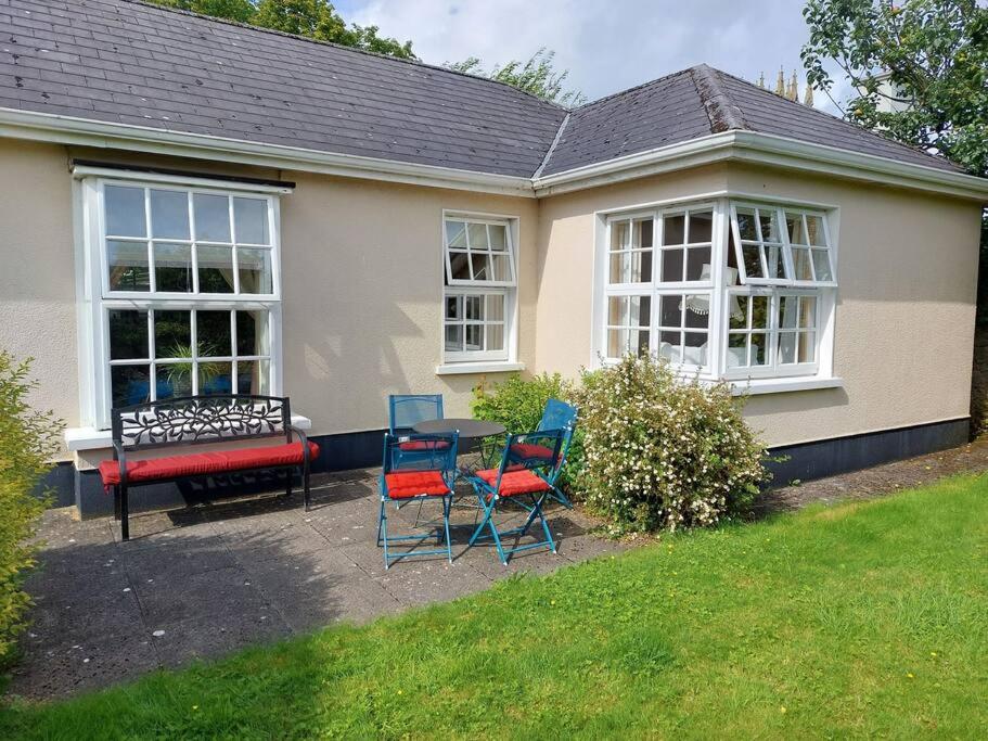 a house with chairs and a table and a bench at Lily's Place - up to 4 persons in Birr