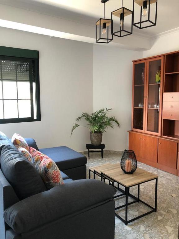 a living room with a couch and a table at MAR DE FORA in Cambados