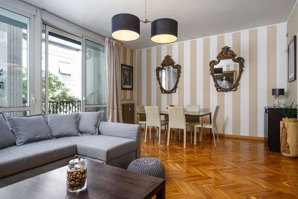 a living room with a couch and a table at Happy Repubblica Milano in Milan