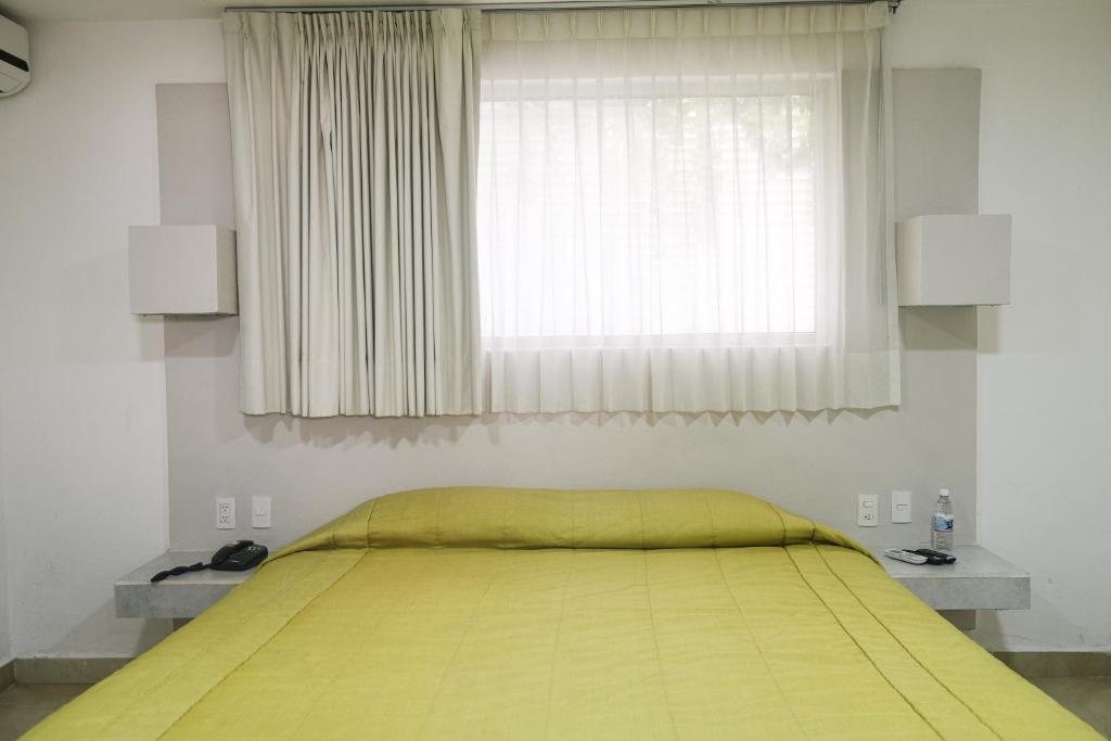 Postel nebo postele na pokoji v ubytování Hotel St. George
