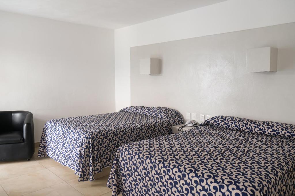 Postel nebo postele na pokoji v ubytování Hotel St. George