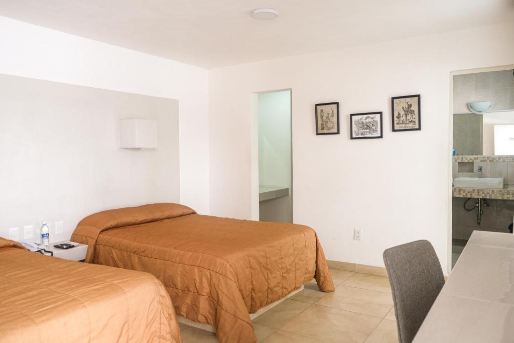 Postel nebo postele na pokoji v ubytování Hotel St. George