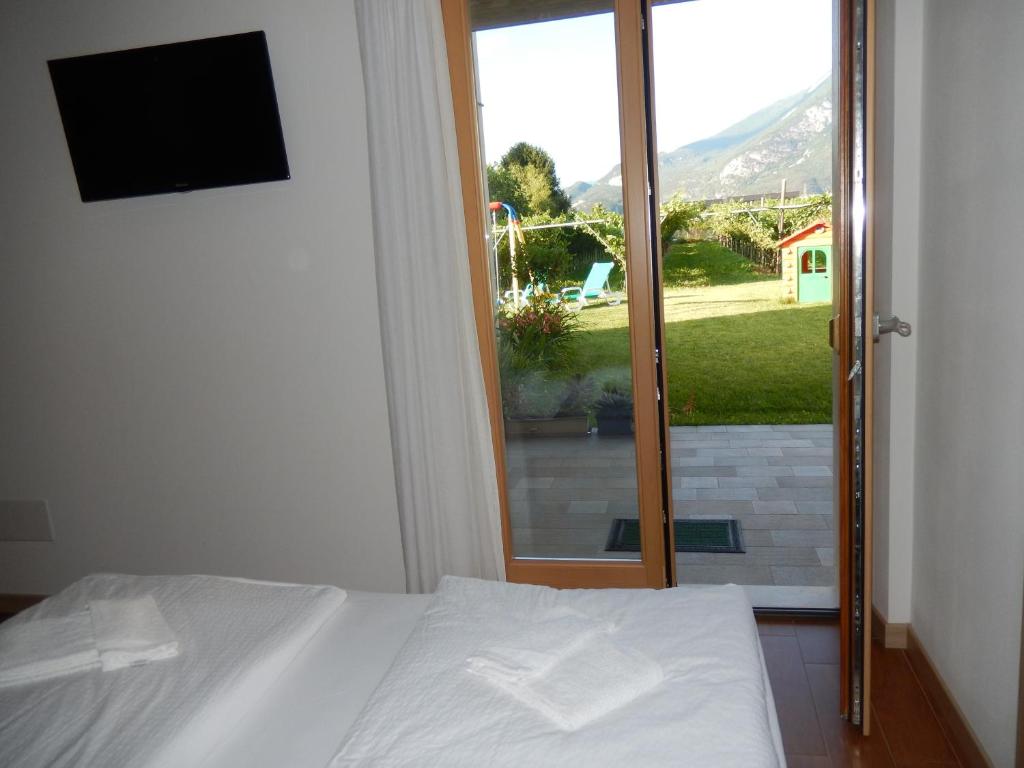 A bed or beds in a room at Agritur Giovanazzi