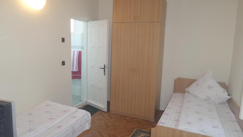 Postel nebo postele na pokoji v ubytování Pensiunea Sapte Pini