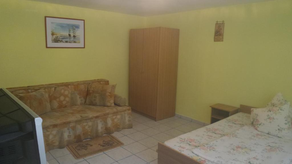 Postel nebo postele na pokoji v ubytování Pensiunea Sapte Pini