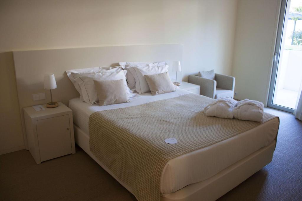 Postel nebo postele na pokoji v ubytování INLIMA Hotel & Spa