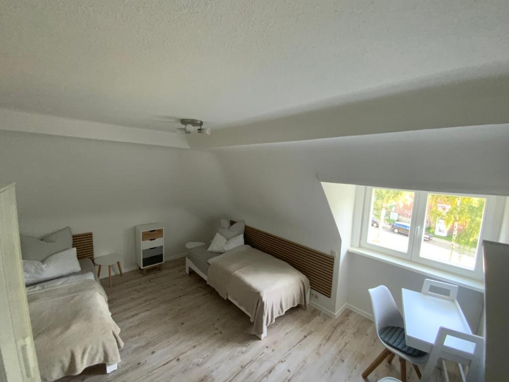 Postel nebo postele na pokoji v ubytování M.C. Apartment Erfurt Südpark
