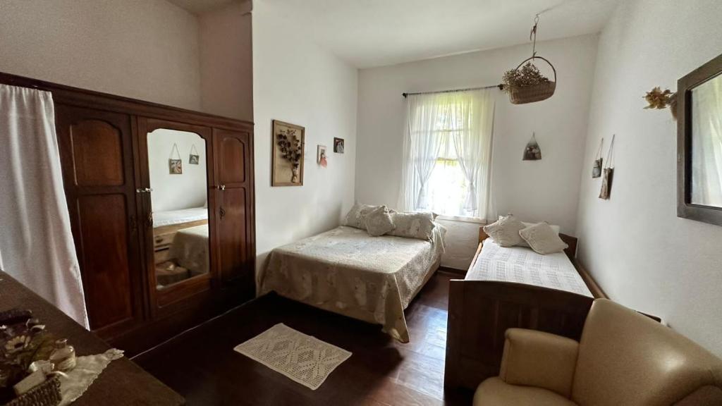 Krevet ili kreveti u jedinici u okviru objekta Refúgio Pasárgada Guest House