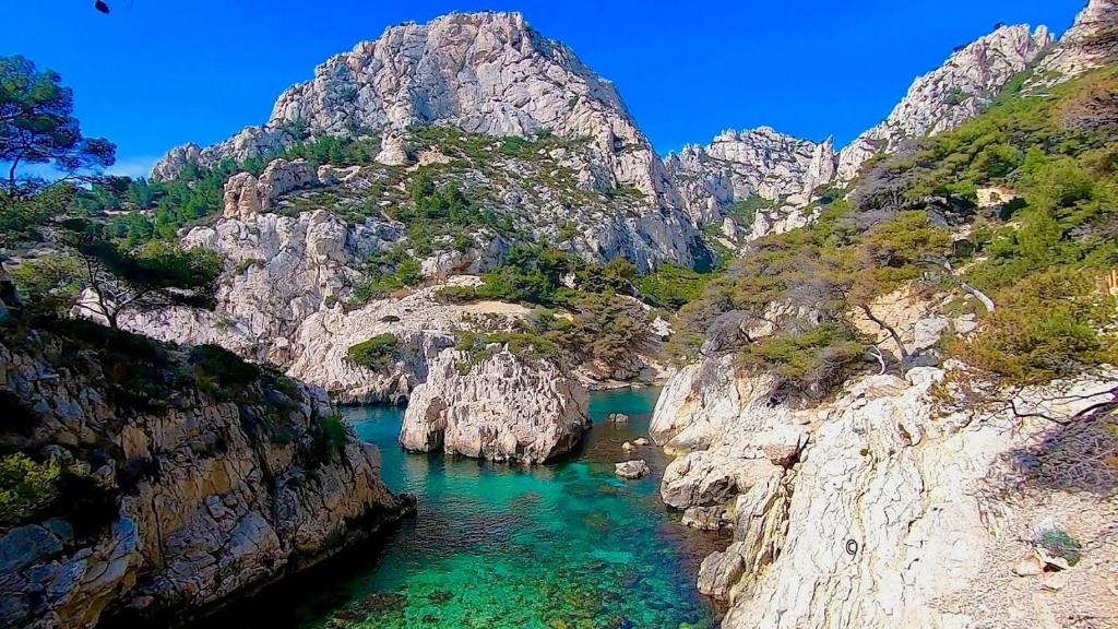a view of a river between two rocky mountains at chez Guy in Marseille