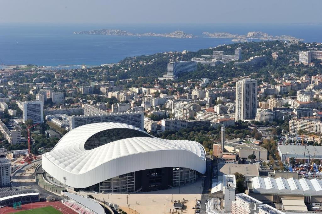an aerial view of a soccer stadium in a city at chez Guy in Marseille
