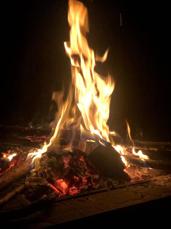 a large fire is lit up at night at chez Guy in Marseille