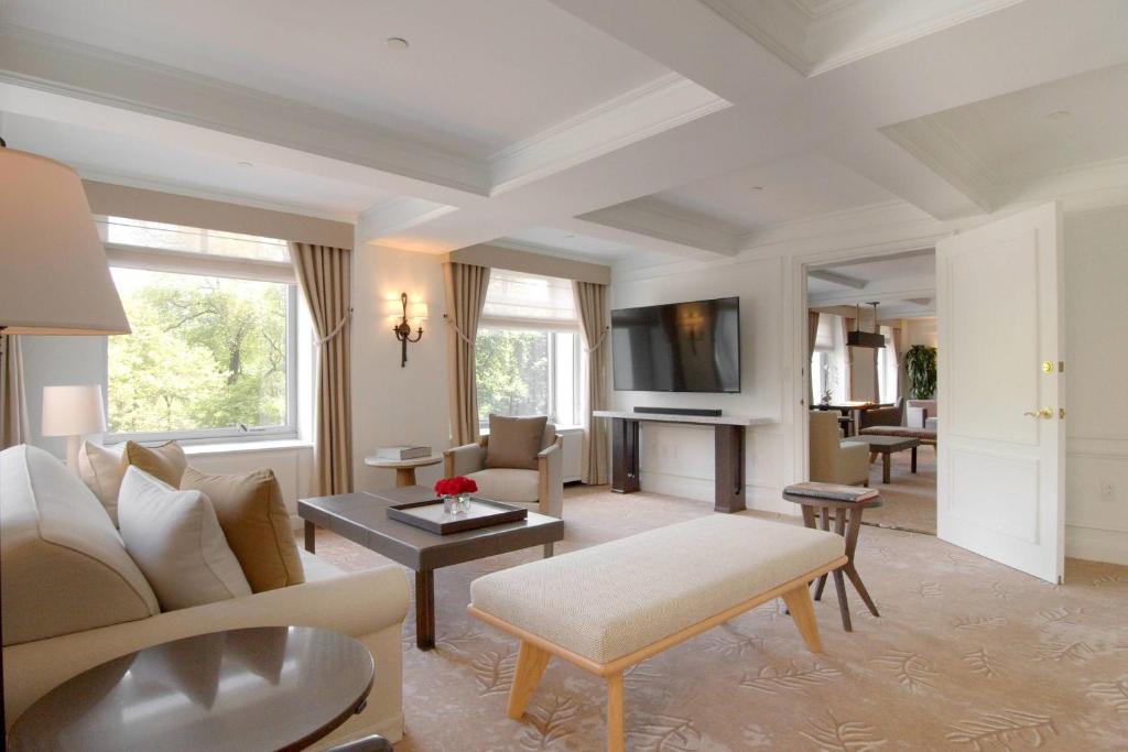 a living room with a couch and a table at The Ritz-Carlton New York, Central Park in New York
