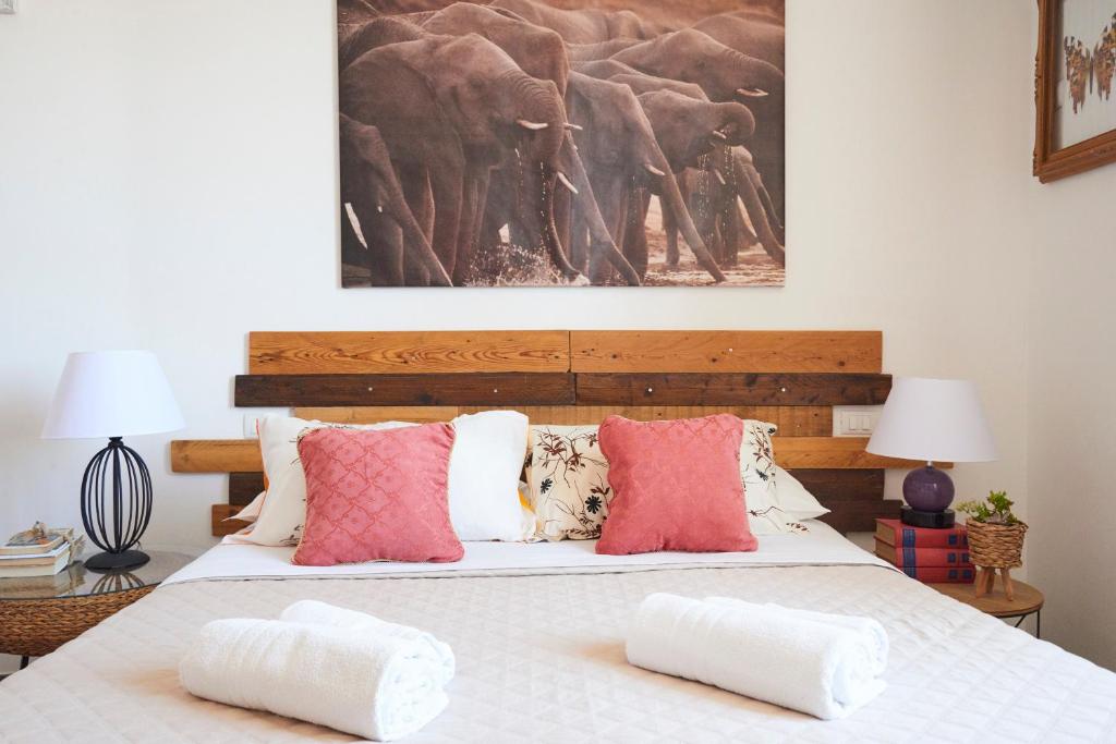 a bedroom with a bed with two pillows on it at Jerry & Titty house in Capena