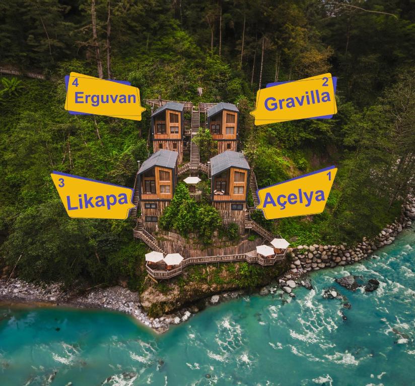 an aerial view of a villa on a hill next to a river at Safir Doğa Evleri in Rize