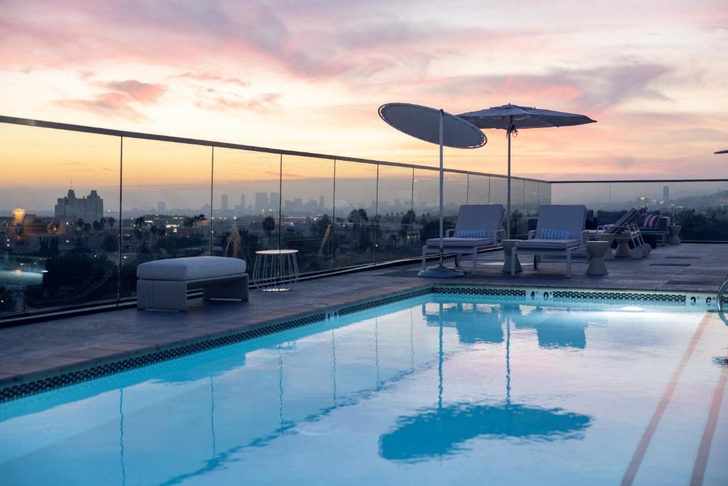a swimming pool on the roof of a building at The Godfrey Hotel Hollywood in Los Angeles
