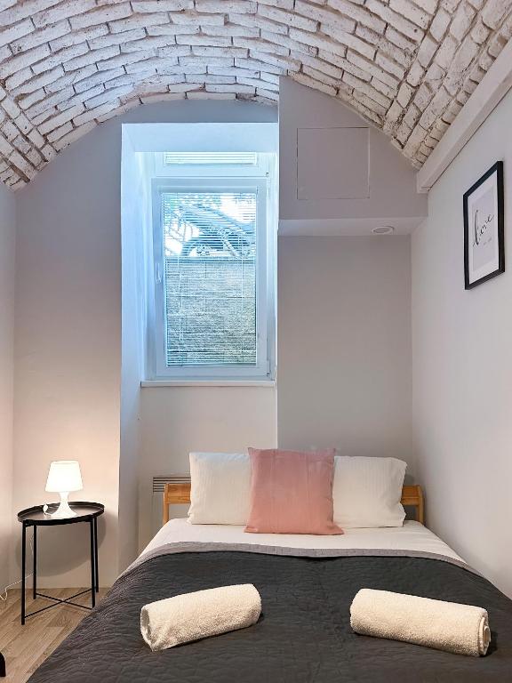 Postel nebo postele na pokoji v ubytování ELSO apartments