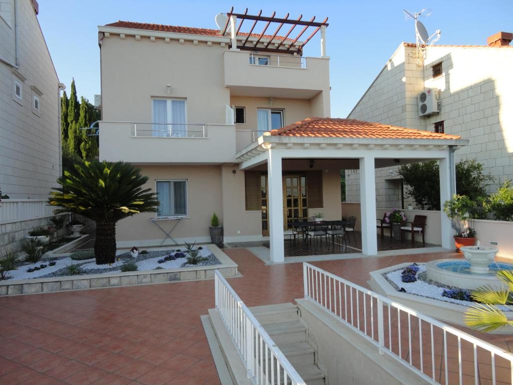 a house with a patio and a gazebo at Soko Apartments & Rooms in Zaton