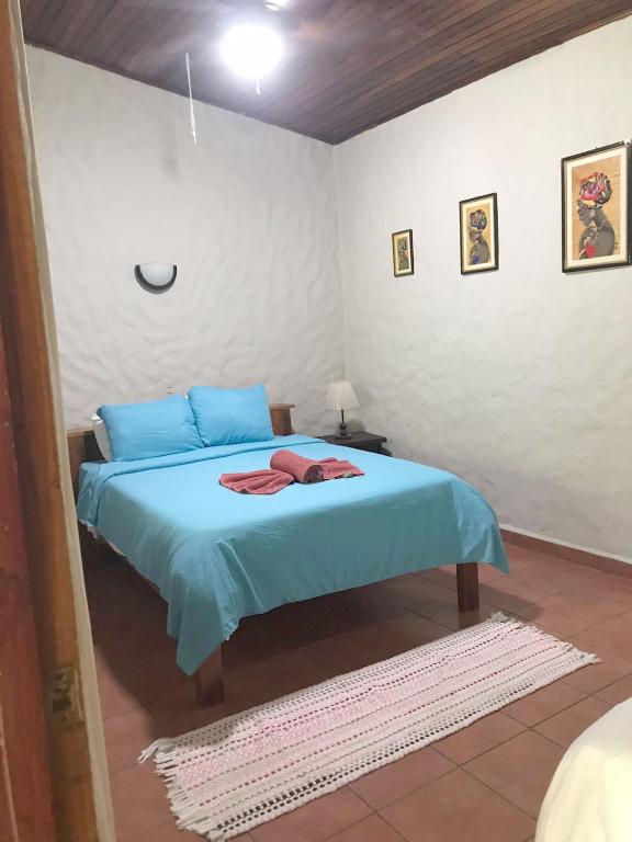 Postel nebo postele na pokoji v ubytování Casa Caribbean Coconut