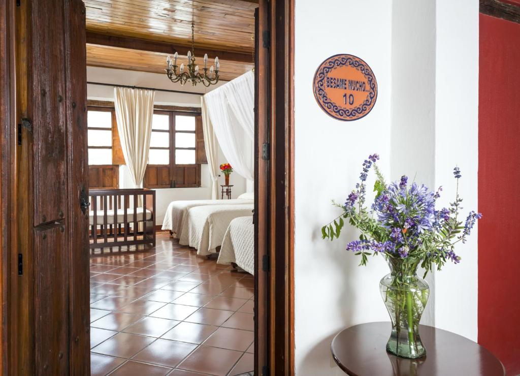 Postel nebo postele na pokoji v ubytování Hotel Tapalpa de Mis Amores
