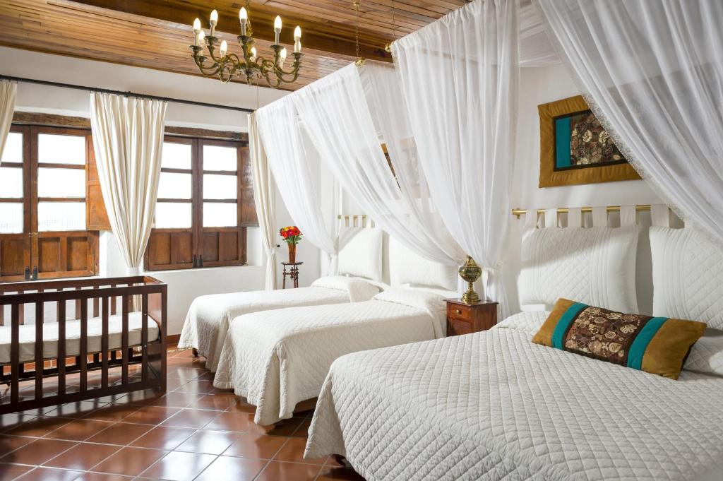 Postel nebo postele na pokoji v ubytování Hotel Tapalpa de Mis Amores