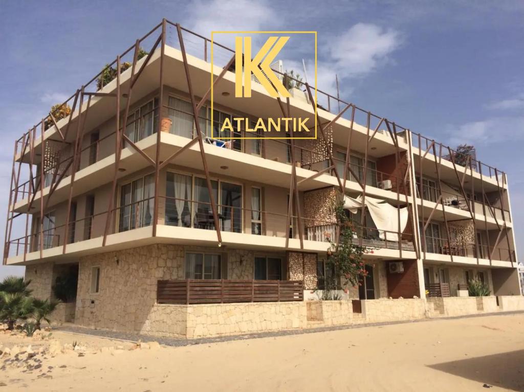 a large building with a sign on top of it at KatlantiK Ca Madeira Deluxe in Sal Rei