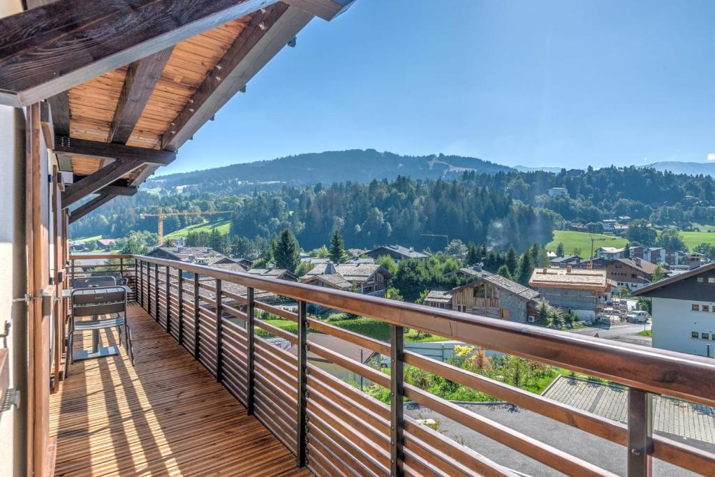 a balcony with a view of the mountains at Beautiful T4 near the Megève ski lifts - Welkeys in Demi-Quartier