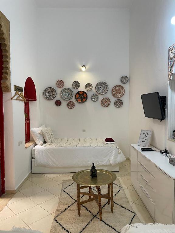 Een TV en/of entertainmentcenter bij Riad Maya
