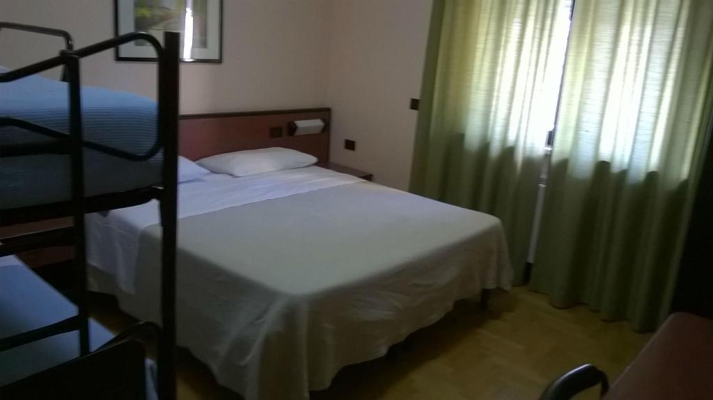 Postel nebo postele na pokoji v ubytování Hotel Du Parc