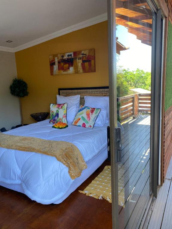 a bedroom with a bed and a sliding glass door at RRT Retreat Oasis in Pretoria