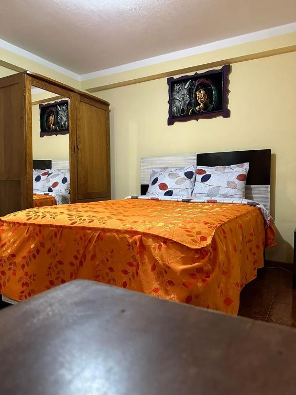 Postel nebo postele na pokoji v ubytování Hospedaje Qoricha'skas