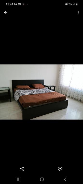 a bed sitting in a bedroom with a window at Luxry apartment in Abdoun. Amman, jordan in Amman