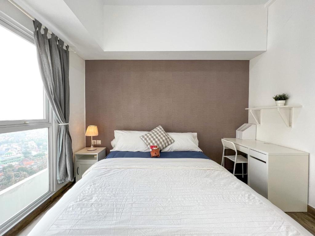 Voodi või voodid majutusasutuse Contemporary Comfort Sleek Studio Casa De Parco toas