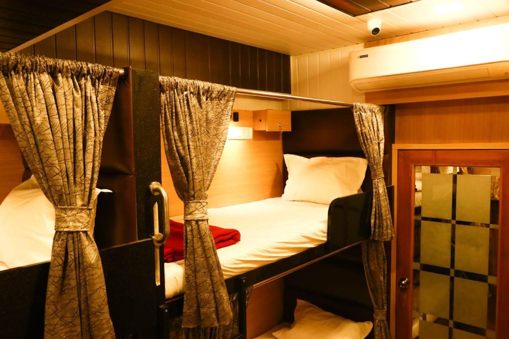a couple of bunk beds in a room at Dormitory Hub in Mumbai