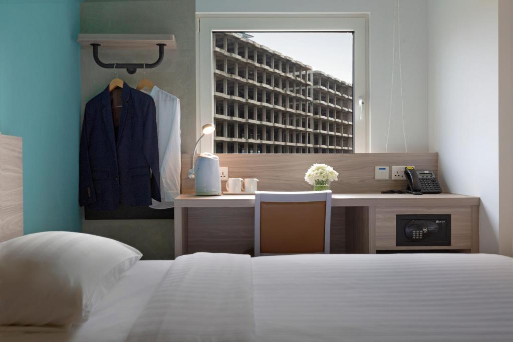 Postel nebo postele na pokoji v ubytování ibis budget Phnom Penh Riverside