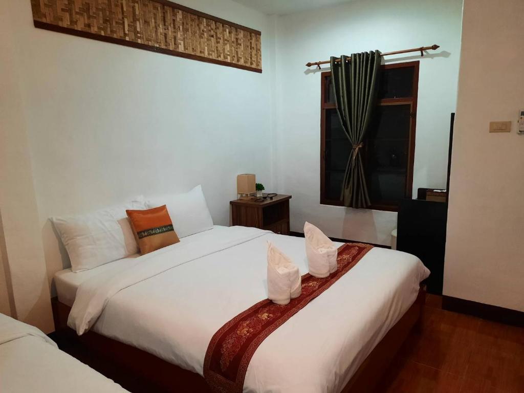 Postel nebo postele na pokoji v ubytování Hotel Pailifornia