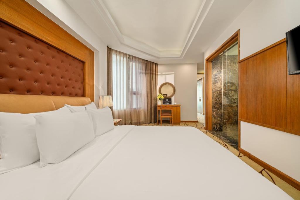 Postel nebo postele na pokoji v ubytování Diamond Sea Hotel