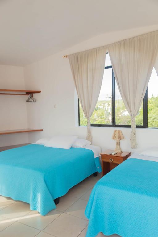 Postel nebo postele na pokoji v ubytování Casa de Nelly