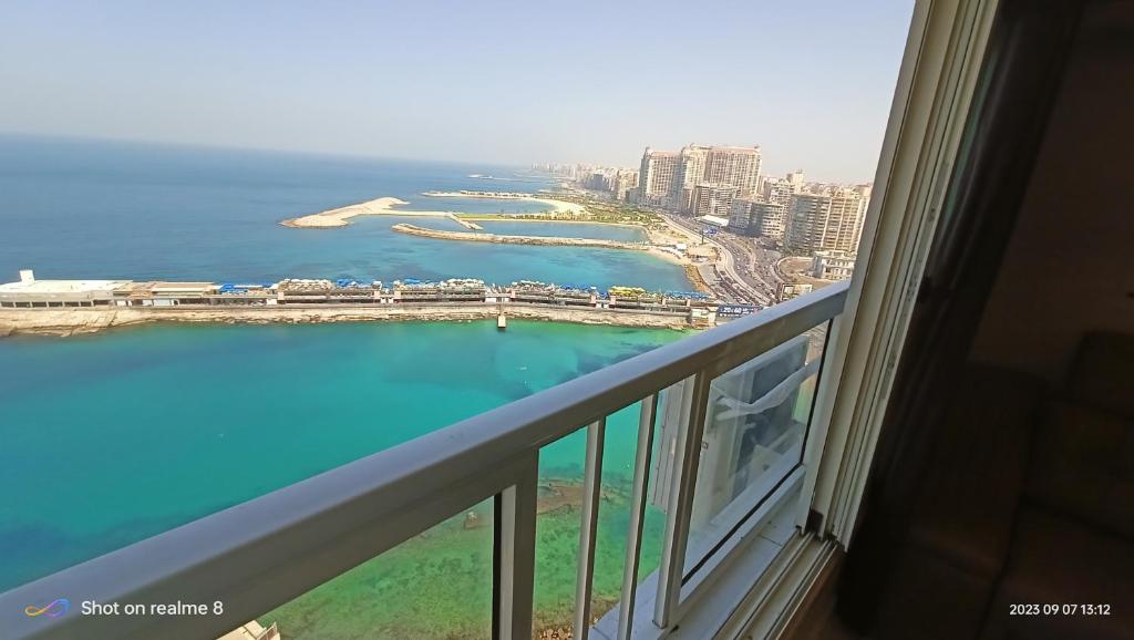 a view of the ocean from a hotel window at Gleem Luxury Condo Direct Sea view G18 in Alexandria