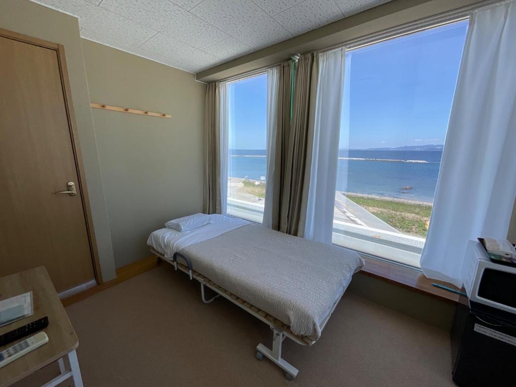 a hospital room with a bed and a large window at Tahara - House - Vacation STAY 14422 in Tahara