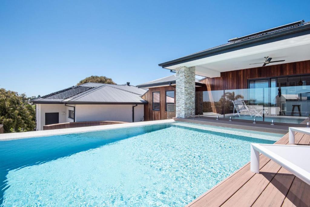 a swimming pool in the backyard of a house at Lotus Luxury Resort Sorrento with pool in Sorrento