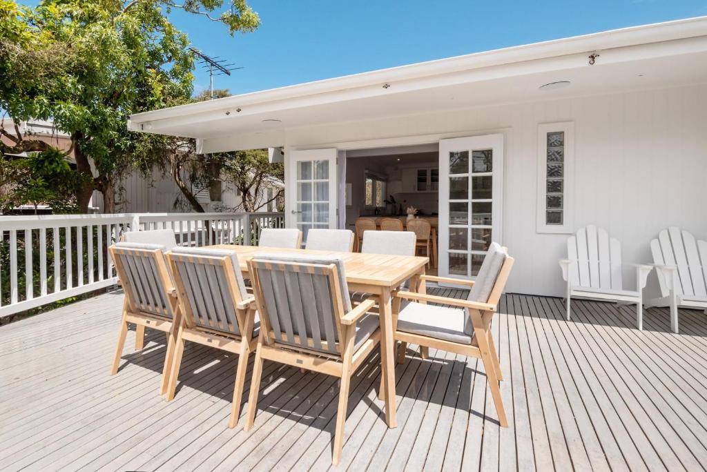 a wooden table and chairs on a deck at Lansdown House Blairgowrie in Blairgowrie
