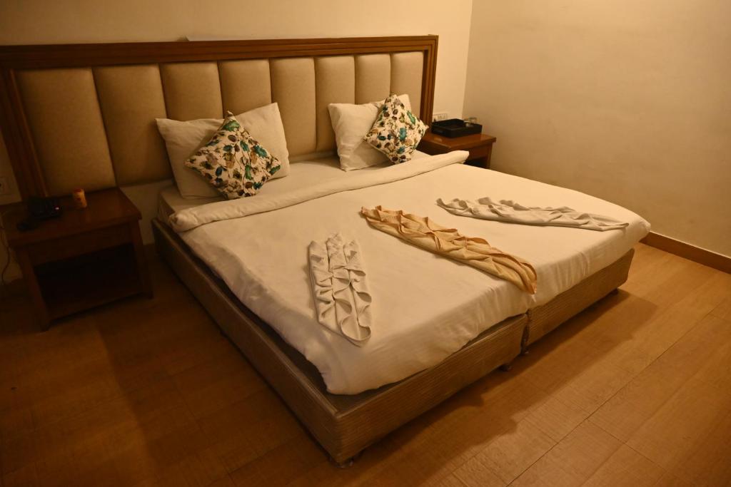 Postel nebo postele na pokoji v ubytování HOTEL SUN GREEN