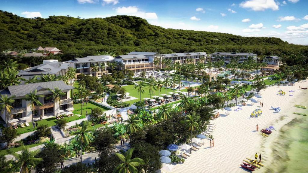 een luchtzicht op een resort met een strand bij Canopy By Hilton Seychelles Resort in Anse a La Mouche